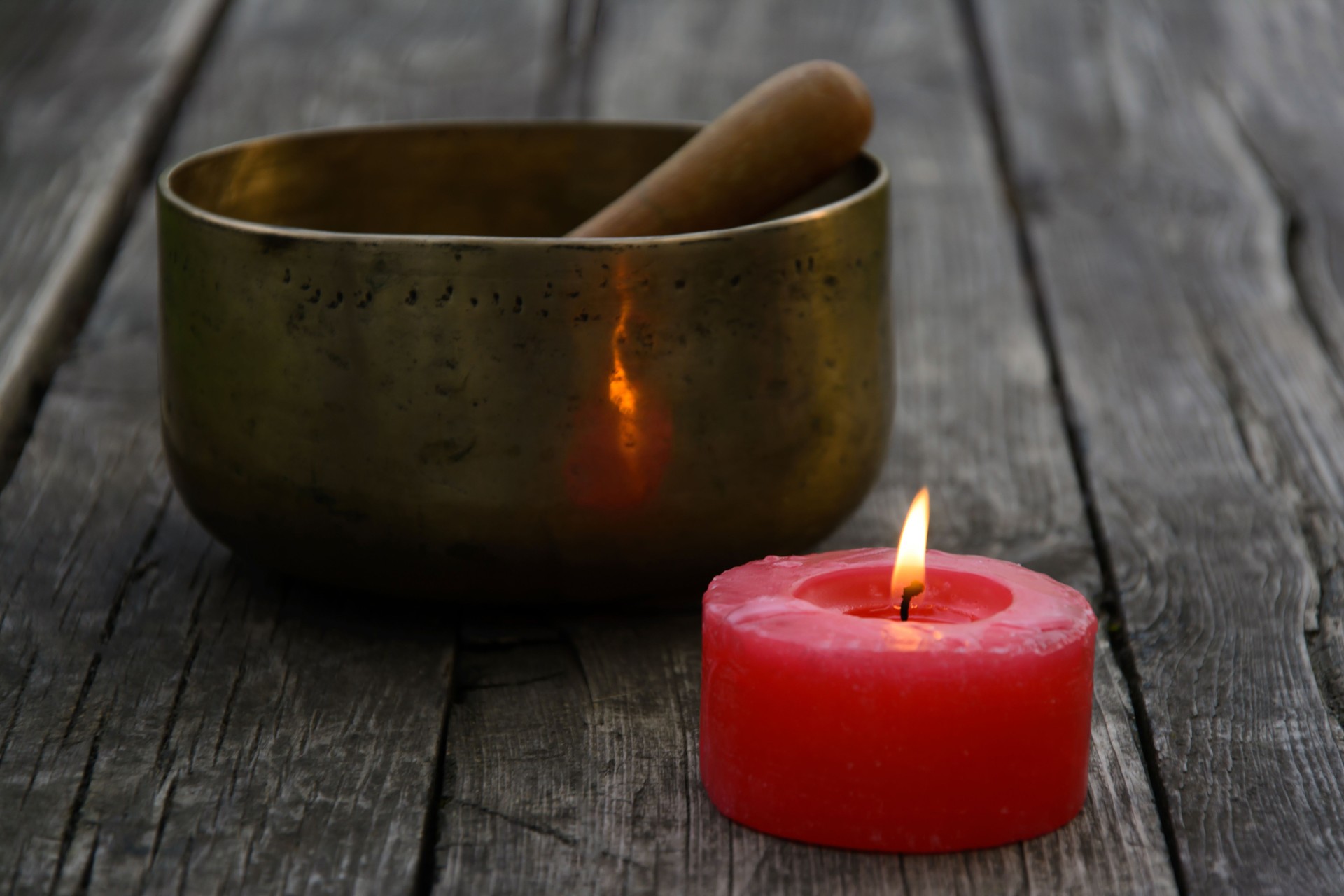 Singing Bowl and burning red candle