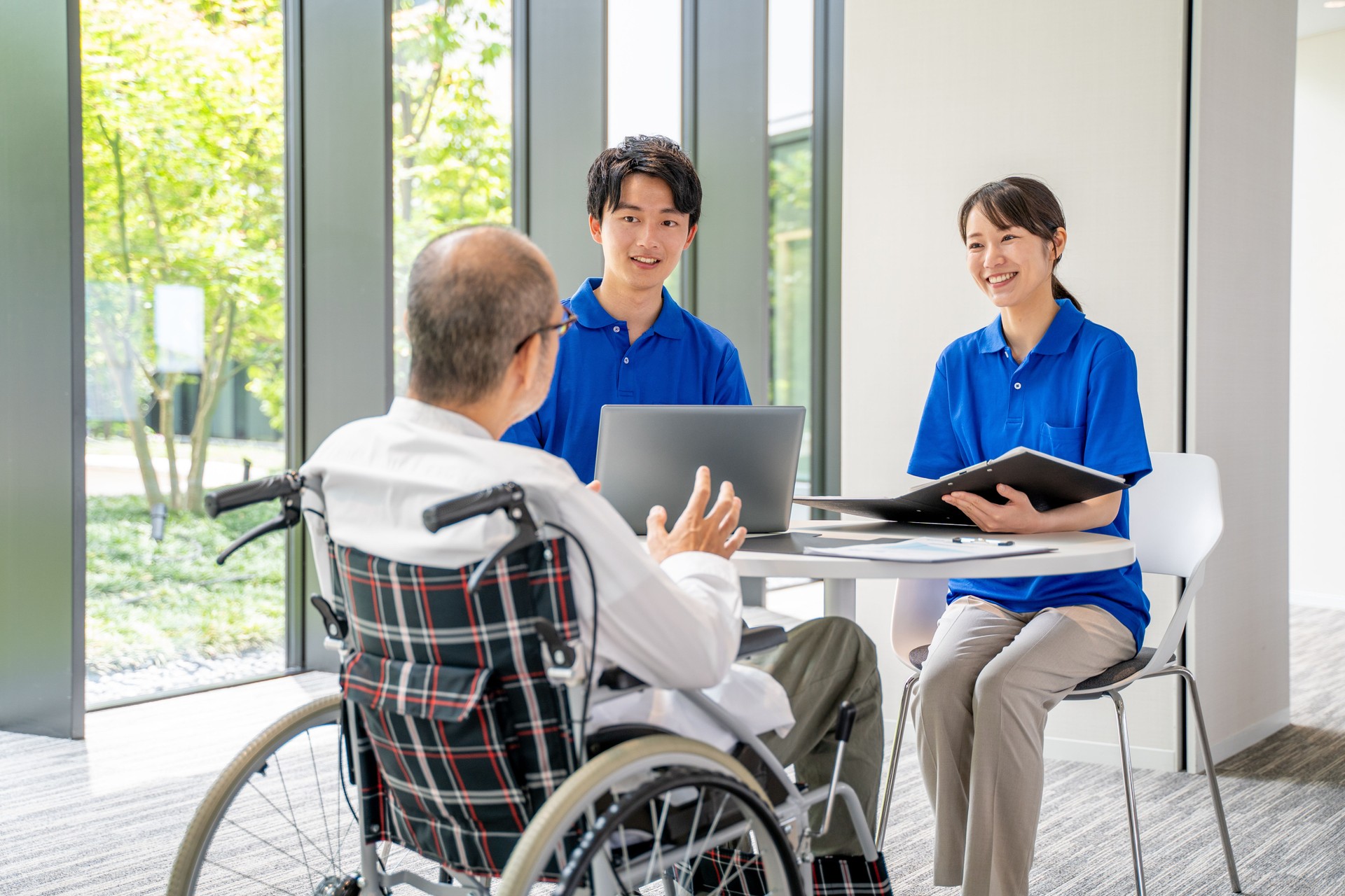 Nursing staff and senior man counseling